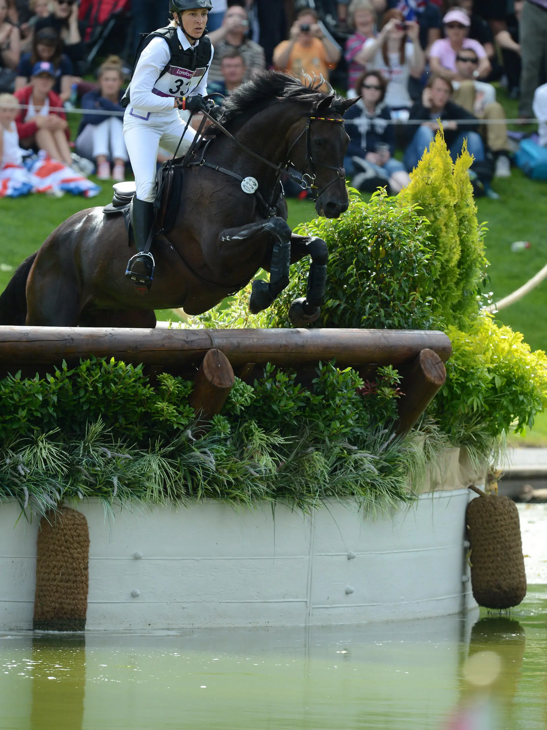 German eventing rider Ingrid Klimke jumps with her horse Butts Abraxxas during the Eventing Cross Country of the Equestrian competition in Greenwich Park at the London 2012 Olympic Games, London, Great Britain, 30 July 2012. Photo: Jochen Luebke dpa  +++(c) dpa - Bildfunk+++