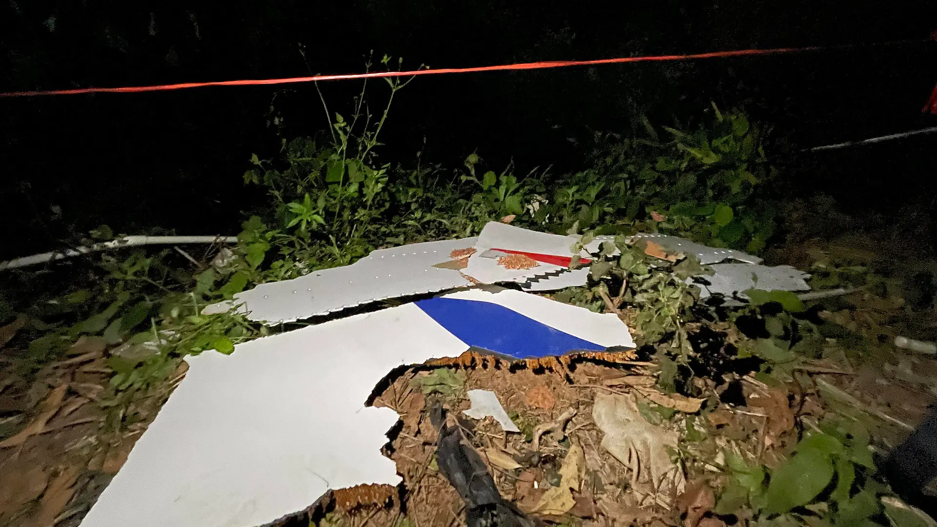  220322 -- TENGXIAN, March 22, 2022 -- Photo taken with a mobile phone shows pieces of a crashed passenger plane s wreckage found at the crash site in Tengxian County, south China s Guangxi Zhuang Autonomous Region, March 22, 2022. A passenger plane with 132 people aboard crashed in south China s Guangxi Zhuang Autonomous Region on Monday afternoon, the regional emergency management department said. The China Eastern Airlines Boeing 737 aircraft, which departed from Kunming and was bound for Guangzhou, crashed into a mountainous area near the Molang village in Tengxian County in the city of Wuzhou at 2:38 p.m., causing a mountain fire, according to the department. The airline said the cause of the accident will be fully investigated.  CH PUBLICATIONxNOTxINxCHN