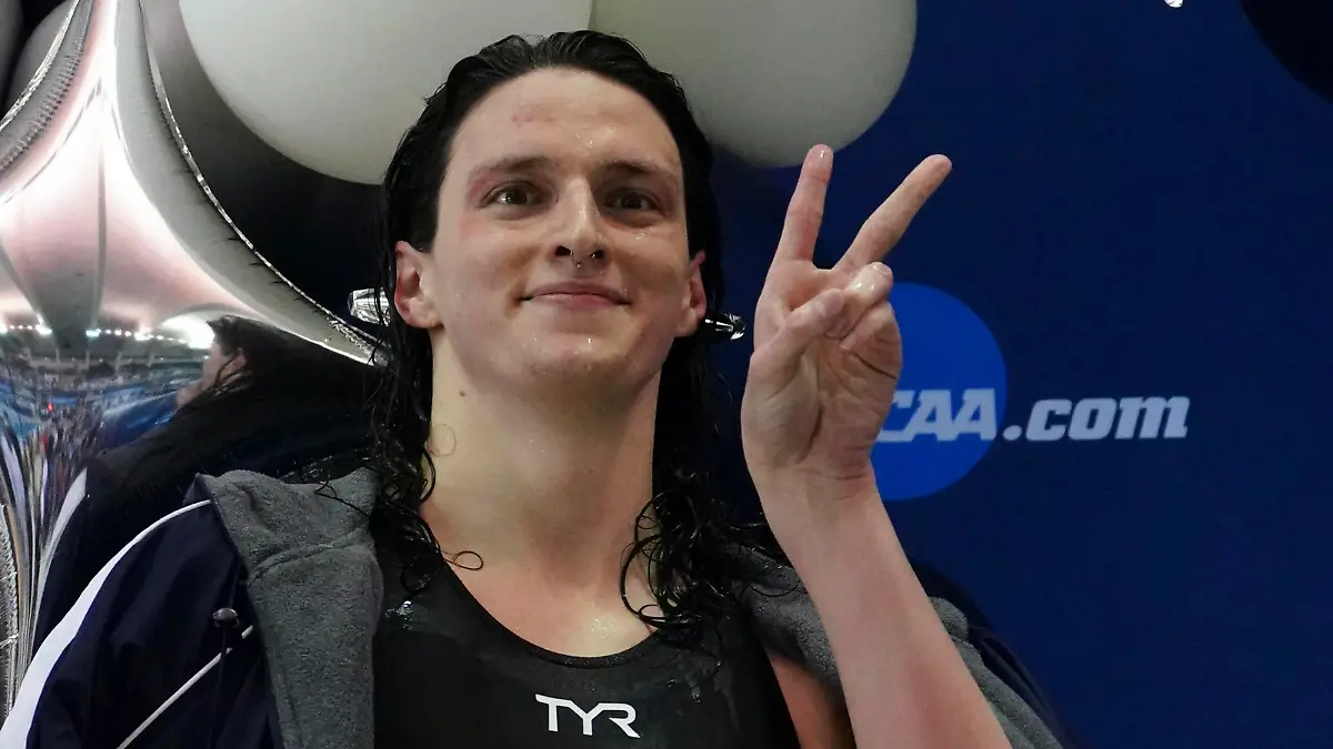 Pennsylvania's Lia Thomas gestures as she holds the trophy after winning the 500-yard freestyle at the NCAA swimming and diving championships Thursday, March 17, 2022, at Georgia Tech in Atlanta. Thomas is the first known transgender woman to win an NCAA swimming championship. (AP Photo/John Bazemore)