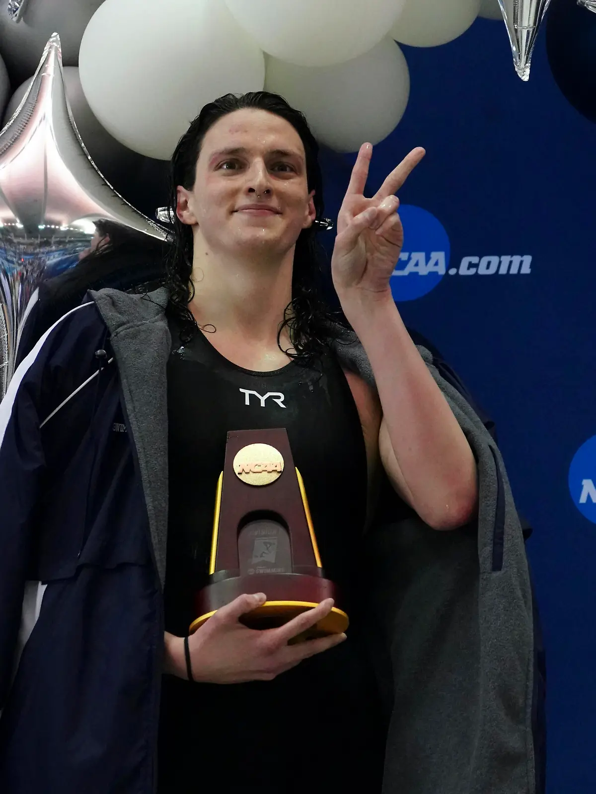 Pennsylvania's Lia Thomas gestures as she holds the trophy after winning the 500-yard freestyle at the NCAA swimming and diving championships Thursday, March 17, 2022, at Georgia Tech in Atlanta. Thomas is the first known transgender woman to win an NCAA swimming championship. (AP Photo/John Bazemore)