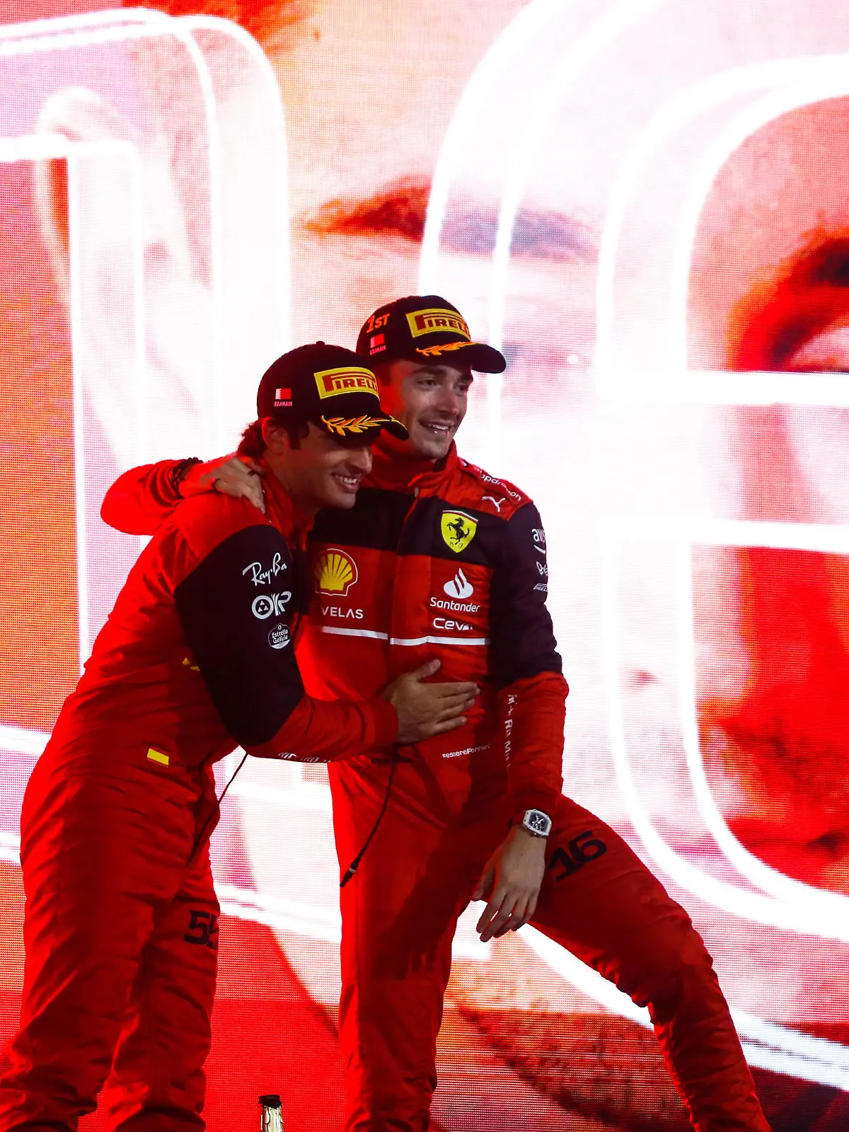  Formula 1 2022: Bahrain GP BAHRAIN INTERNATIONAL CIRCUIT, BAHRAIN - MARCH 20: Carlos Sainz, Ferrari, 2nd position, and Charles Leclerc, Ferrari, 1st position, celebrate on the podium during the Bahrain GP at Bahrain International Circuit on Sunday March 20, 2022 in Sakhir, Bahrain. Photo by Carl Bingham / LAT Images Images PUBLICATIONxINxGERxSUIxAUTxHUNxONLY GP2201_175139_31I2412