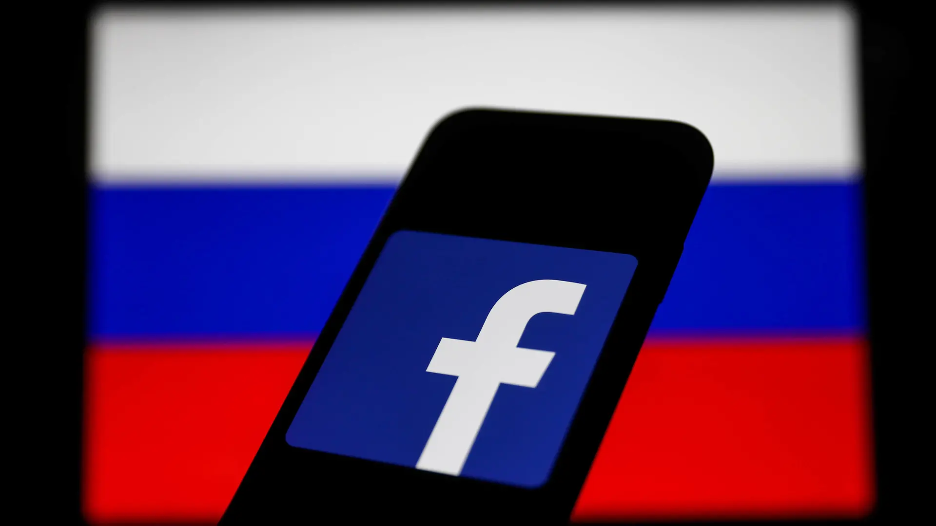  Russia And Technology Companies Photo Illustrations Facebook logo displayed on a phone screen and Russian flag displayed on a screen in the background are seen in this illustration photo taken in Krakow, Poland on March 1, 2022. Photo Illustration by Jakub Porzycki/NurPhoto Krakow Poland PUBLICATIONxNOTxINxFRA Copyright: xJakubxPorzyckix originalFilename: porzycki-russiaan220301_npbUe.jpg
