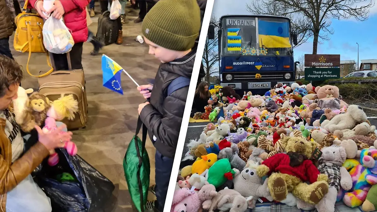 Mann überreicht ukrainischem Kind einen Teddy, vor dem Teddy-Bus liegt ein Berg von Stofftieren