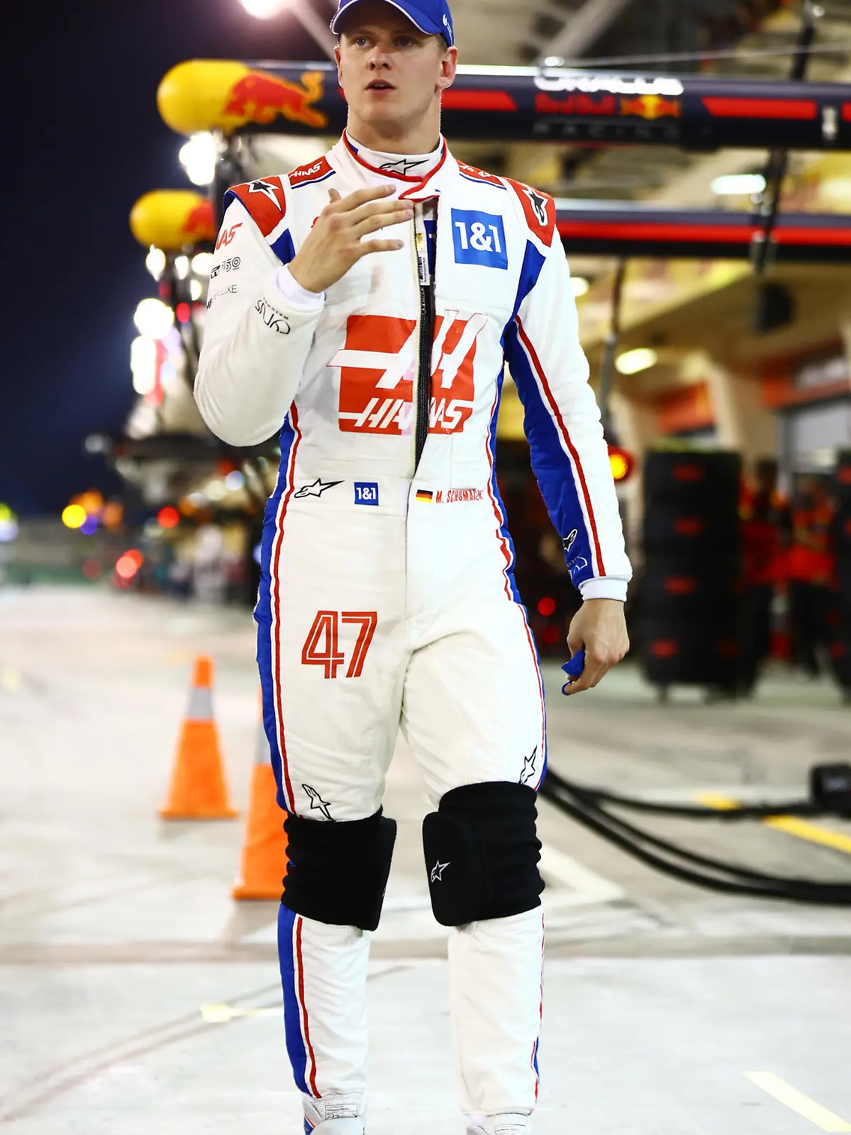 BAHRAIN, BAHRAIN - MARCH 19: Mick Schumacher of Germany and Haas F1 walks in the Pitlane after qualifying in 12th position during qualifying ahead of the F1 Grand Prix of Bahrain at Bahrain International Circuit on March 19, 2022 in Bahrain, Bahrain. (Photo by Mark Thompson/Getty Images)