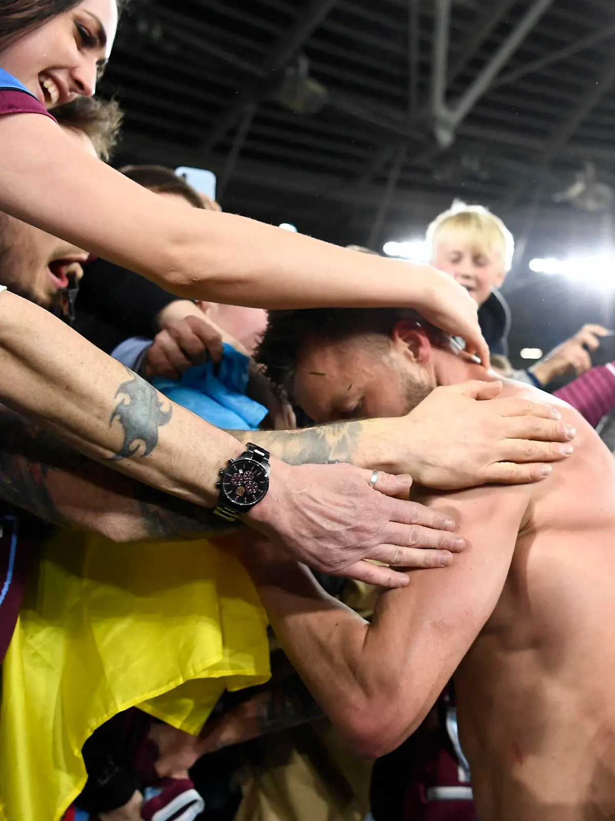 Soccer Football - Europa League - Round of 16 Second Leg - West Ham United v Sevilla - London Stadium, London, Britain - March 17, 2022  A flag is seen in support of Ukraine amid Russia's invasion as West Ham United's Andriy Yarmolenko celebrates with the fans after the match REUTERS/Tony Obrien