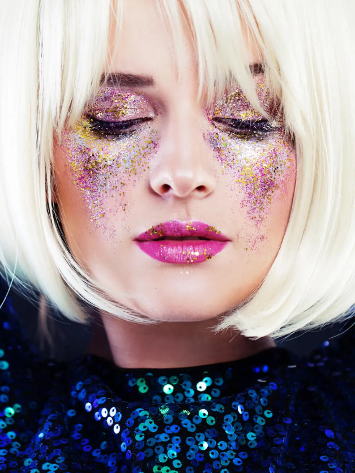 Beautiful Blonde Woman with Party Glitters Makeup