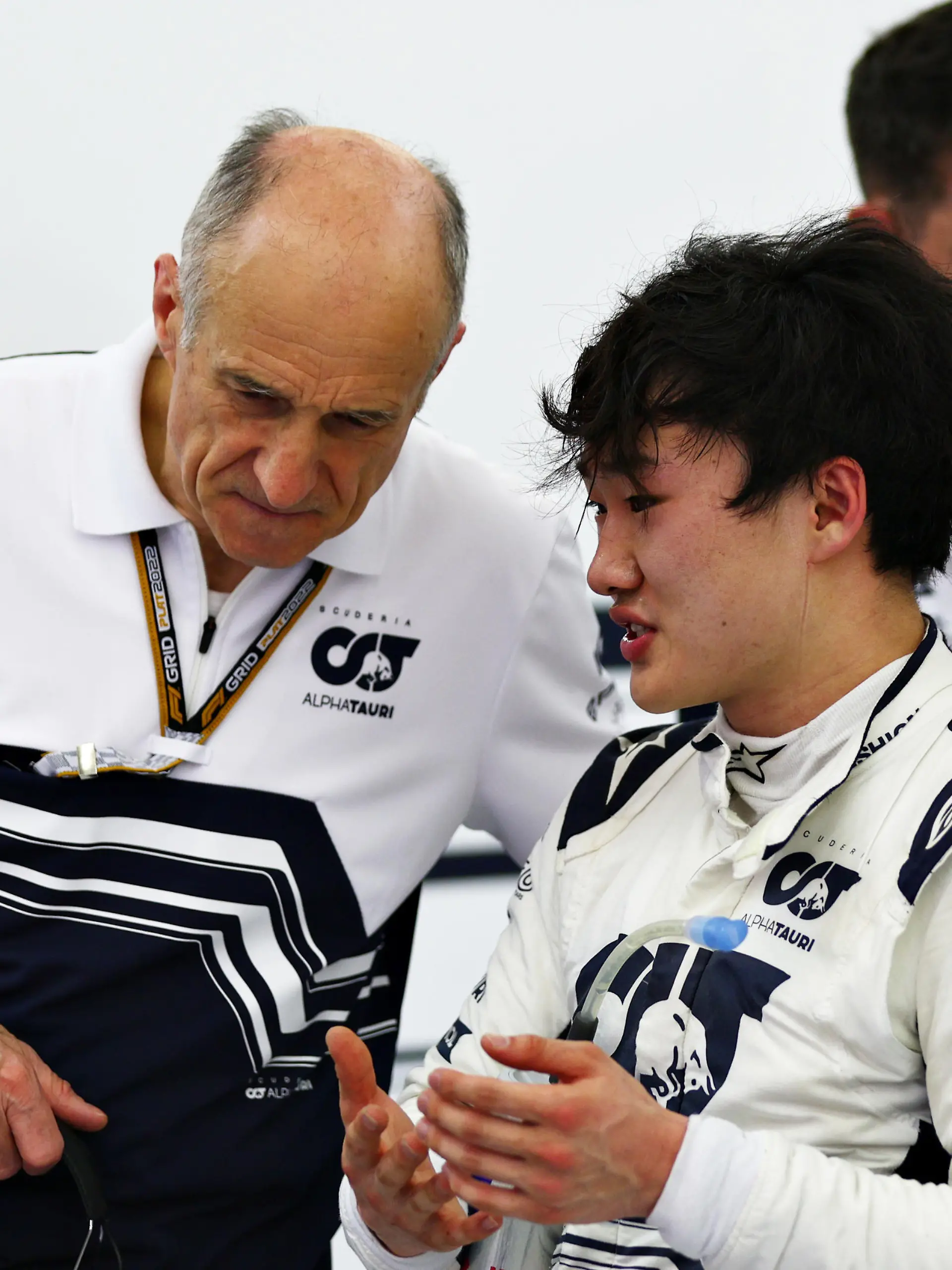 BAHRAIN, BAHRAIN - MARCH 11: Yuki Tsunoda of Japan and Scuderia AlphaTauri talks to Scuderia AlphaTauri Team Principal Franz Tost in the garage during Day Two of F1 Testing at Bahrain International Circuit on March 11, 2022 in Bahrain, Bahrain. (Photo by Lars Baron/Getty Images)