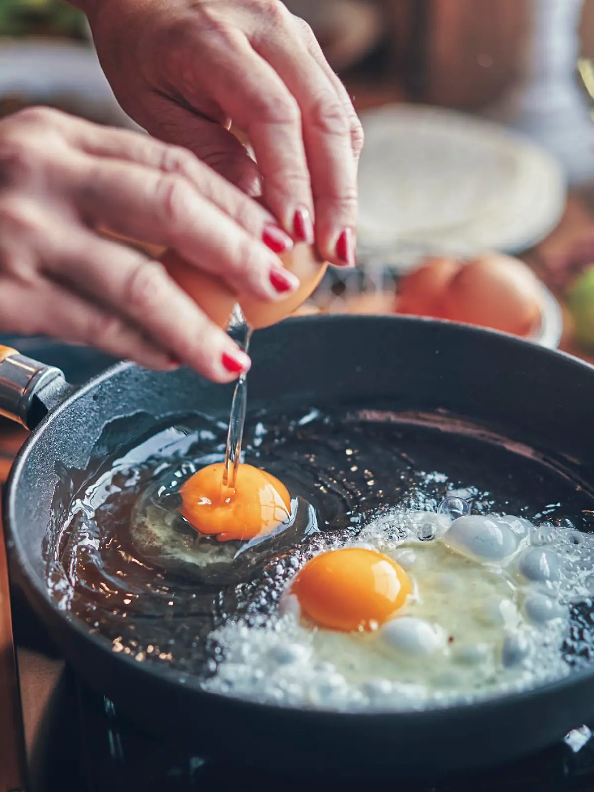                                 Frying Egg in a Cooking Pan in Domestic Kitchen