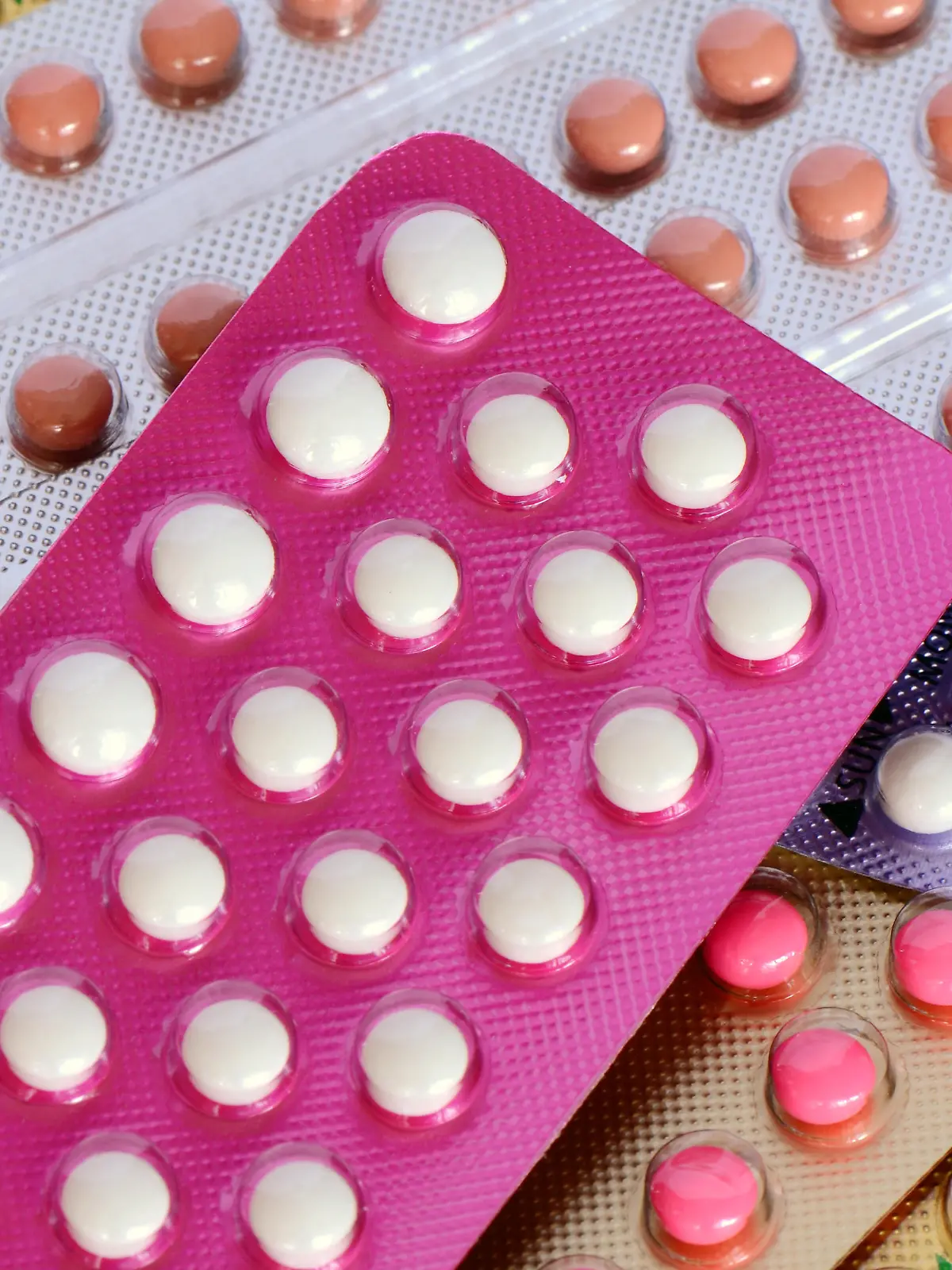 Colorful oral contraceptive pill both 21 and 28 tablets strips.
