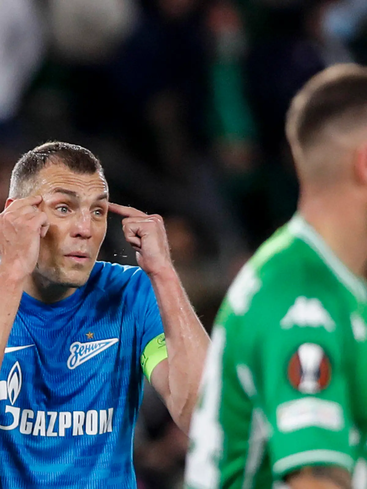 Zenit's Artem Dzyuba, left, reacts during the Europa League play off, second leg soccer match between Betis and Zenit at the Benito Villamarin stadium in Seville, Spain, Thursday, Feb. 24, 2022. (AP Photo/Miguel Morenatti)