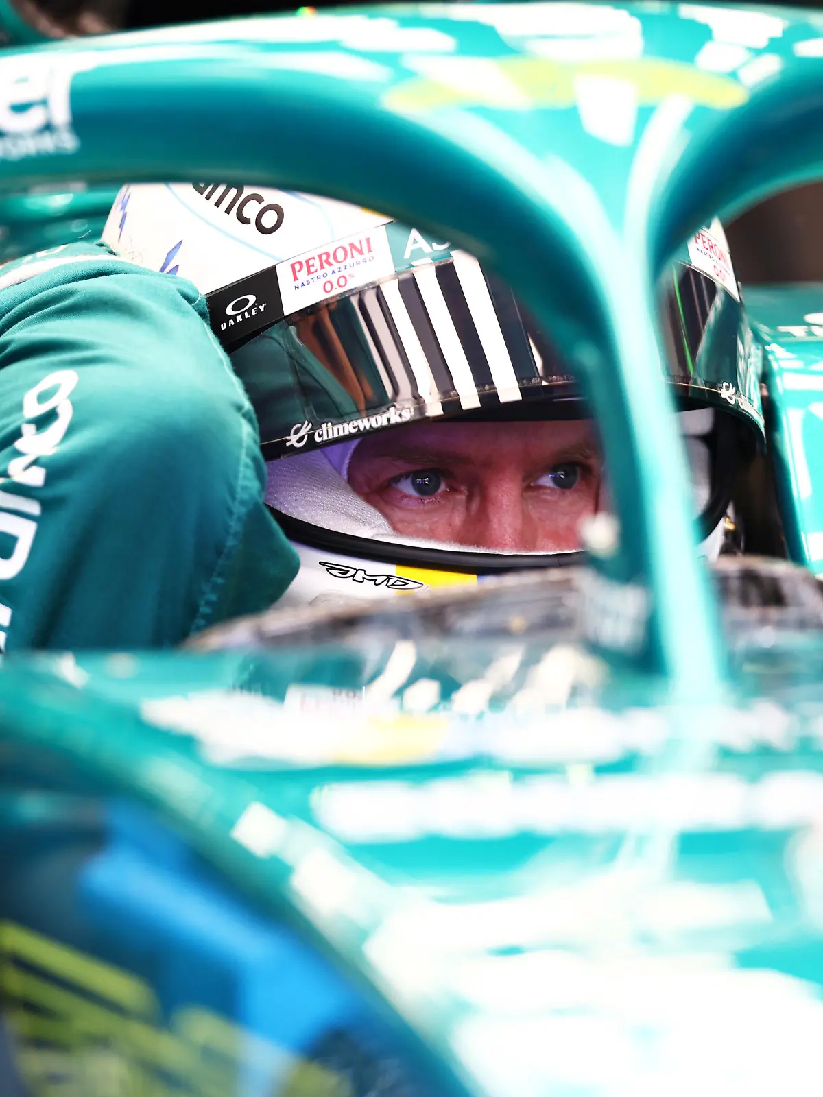 BAHRAIN, BAHRAIN - MARCH 12: Sebastian Vettel of Germany and Aston Martin F1 Team prepares to drive in the garage during Day Three of F1 Testing at Bahrain International Circuit on March 12, 2022 in Bahrain, Bahrain. (Photo by Lars Baron/Getty Images)