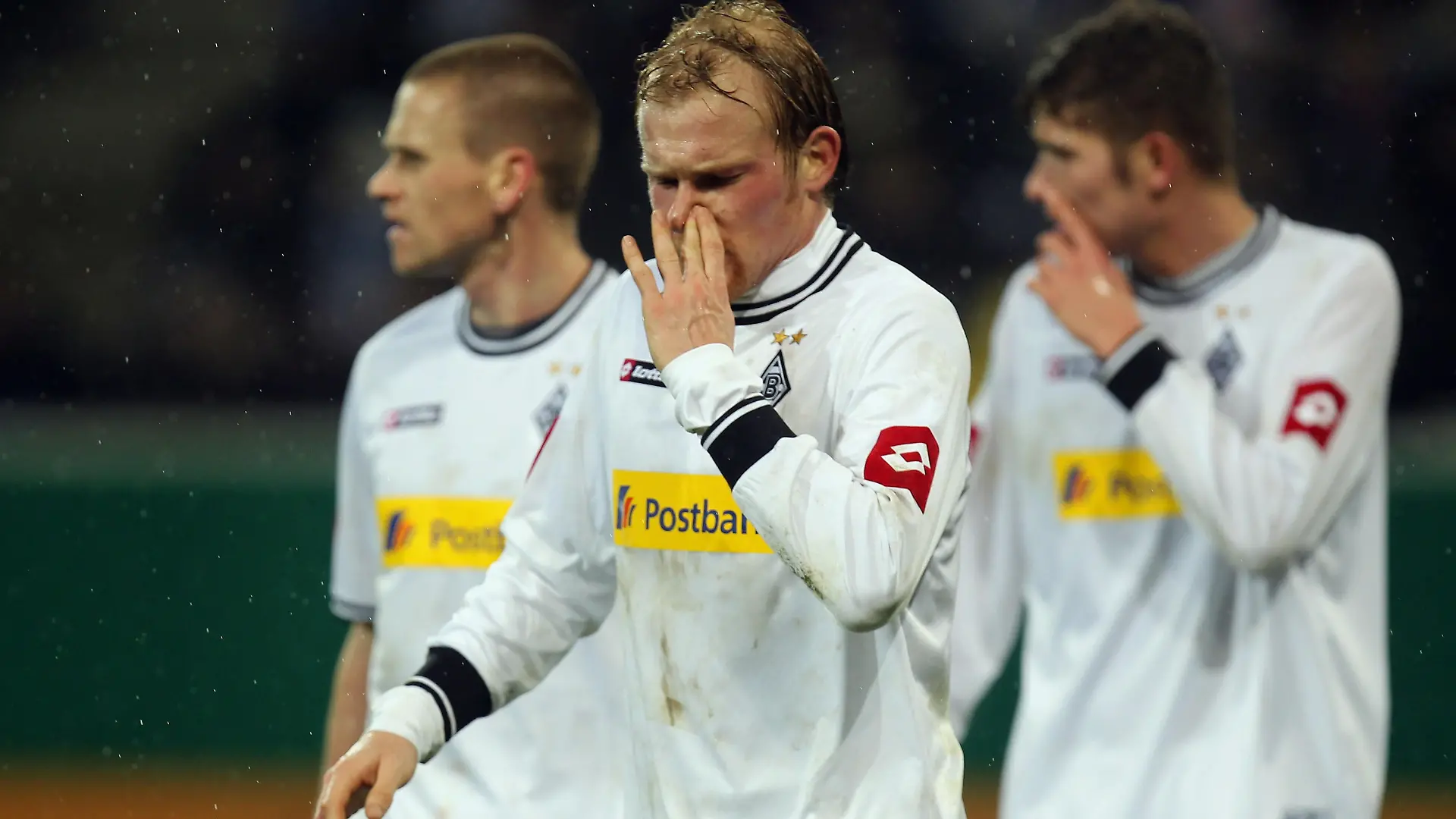 SINSHEIM, GERMANY - DECEMBER 21: Filip Daems, Tobias Levels and Roman Neustaedter (L-R) react after the DFB Cup round of sixteen match between 1899 Hoffenheim and Borussia M'Gladbach at the Rhein-Neckar Arena on December 21, 2010 in Sinsheim, Germany. (Photo by Alex Grimm/Bongarts/Getty Images)