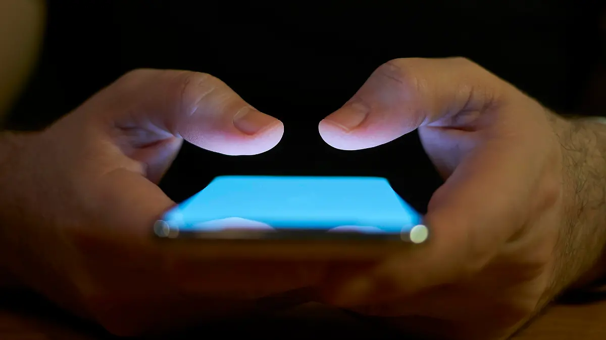 Young Men Using Smart Phone Social Media Concept
