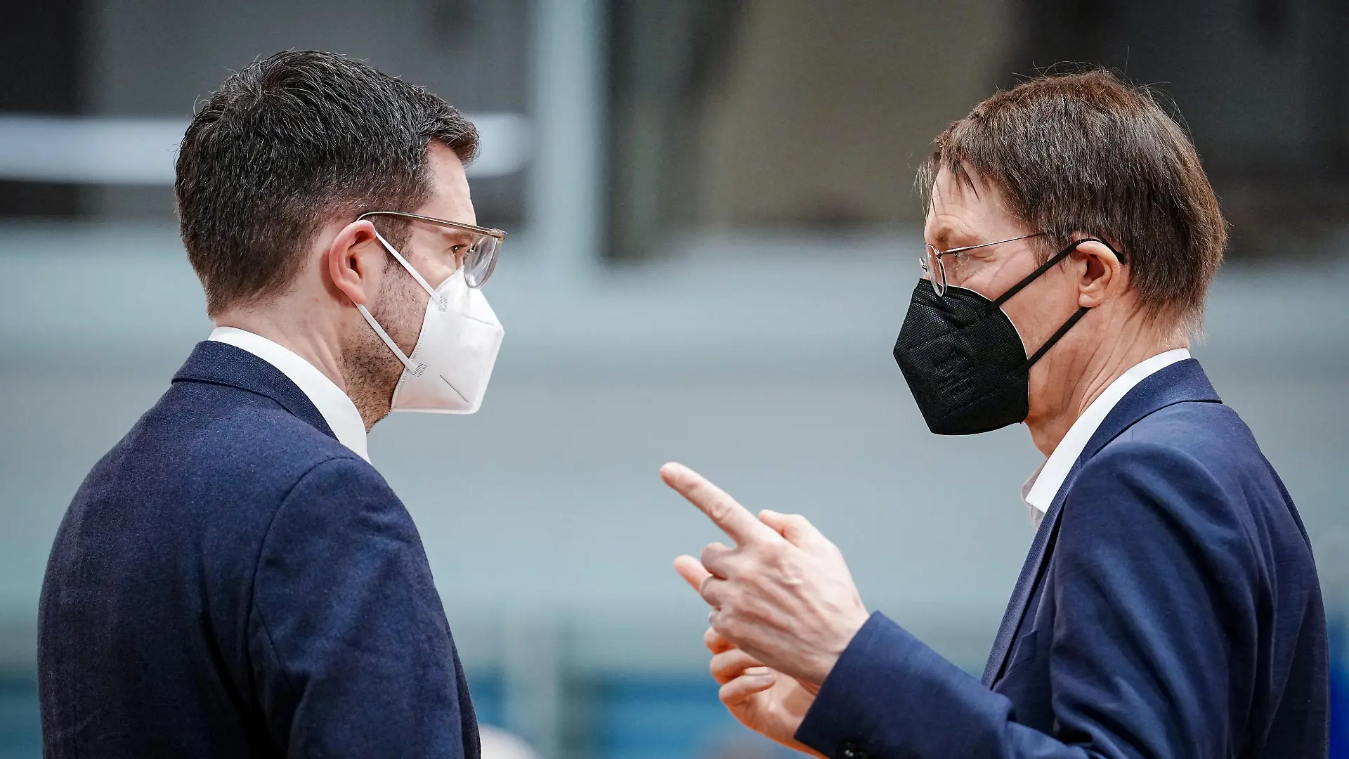German Health Minister Karl Lauterbach and Justice Minister Marco Buschmann wear protective face masks before the weekly cabinet meeting at the Chancellery in Berlin, Germany, February 16, 2022. Kay Nietfeld/Pool via REUTERS