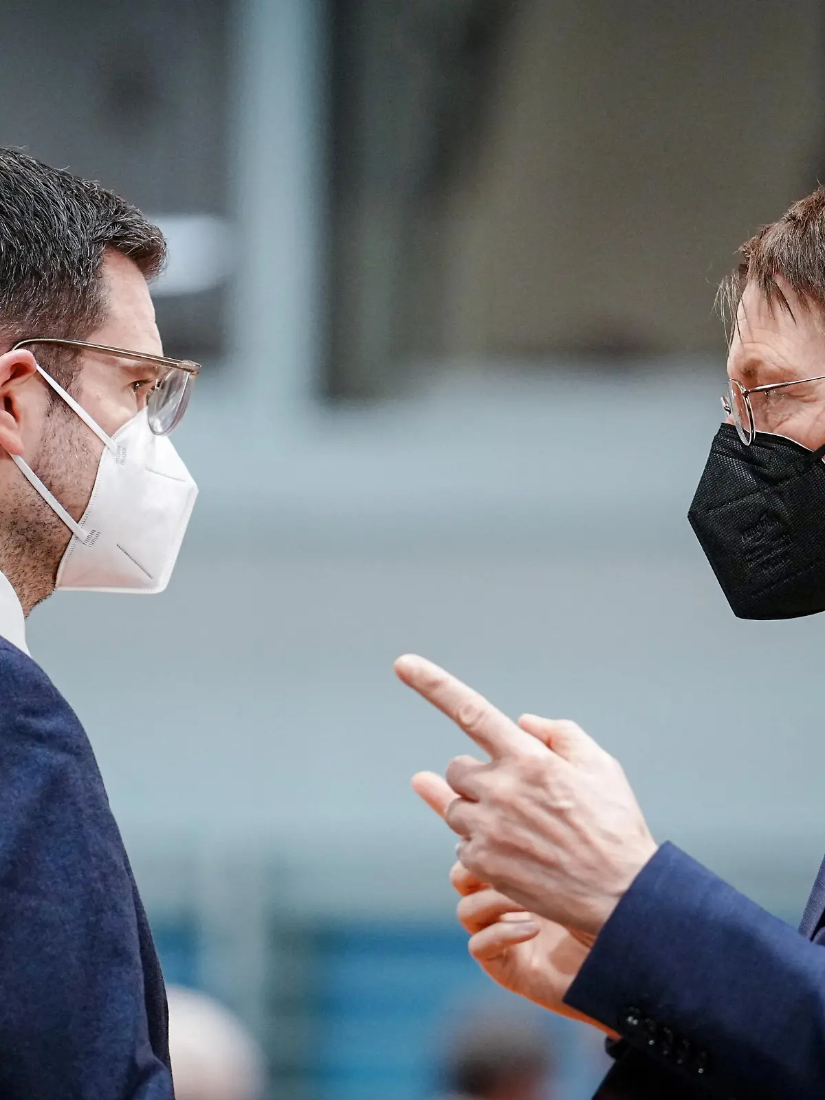 German Health Minister Karl Lauterbach and Justice Minister Marco Buschmann wear protective face masks before the weekly cabinet meeting at the Chancellery in Berlin, Germany, February 16, 2022. Kay Nietfeld/Pool via REUTERS