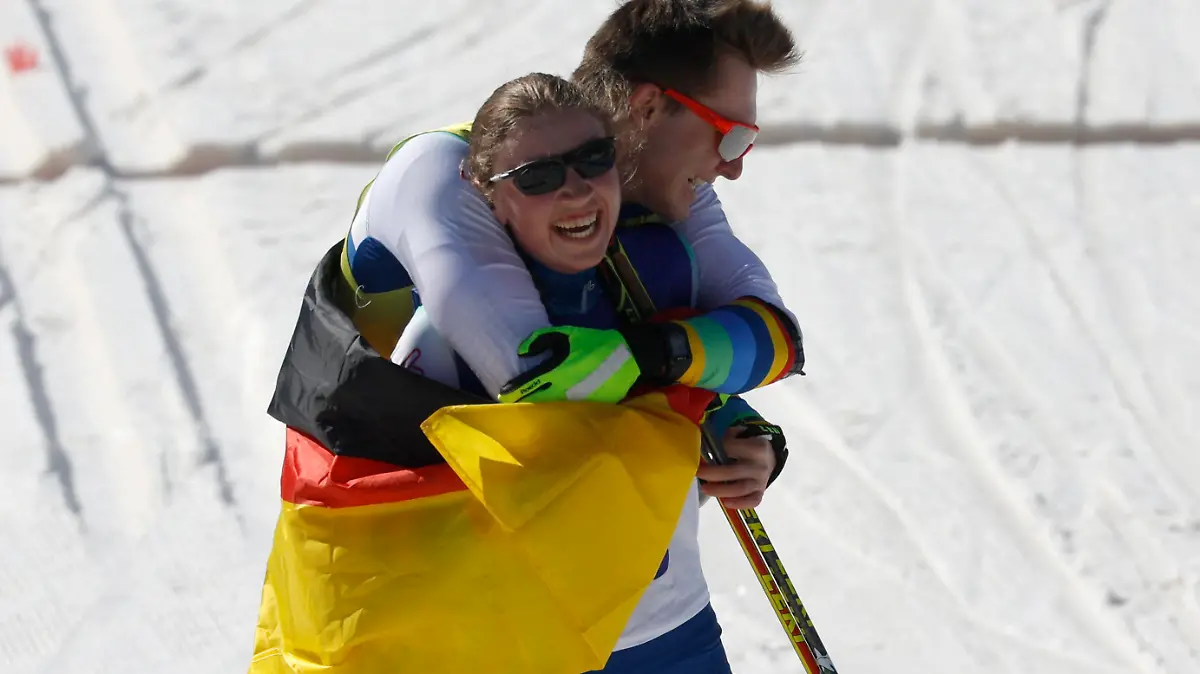 Beijing 2022 Winter Paralympic Games - Para Biathlon - Women's Middle Distance Vision Impaired - National Biathlon Centre, Zhangjiakou, China - March 8, 2022. Leonie Maria Walter of Germany celebrates with guide Pirmin Strecker of Germany after competing. REUTERS/Issei Kato
