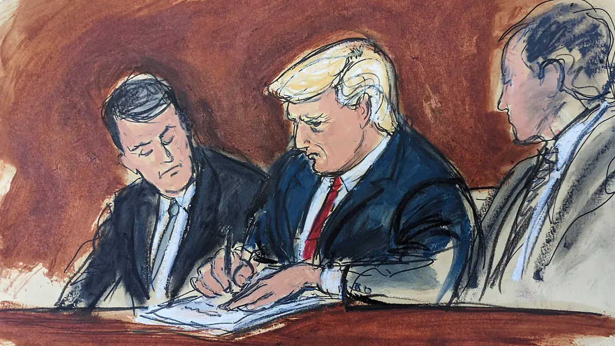 Former President Donald Trump, center, flanked by his defense attorneys, signs his bond in federal court, Tuesday, June 13, 2023, in Miami. Trump plead not guilty to federal charges that he illegally kept classified documents at his Florida estate. (Elizabeth Williams via AP)