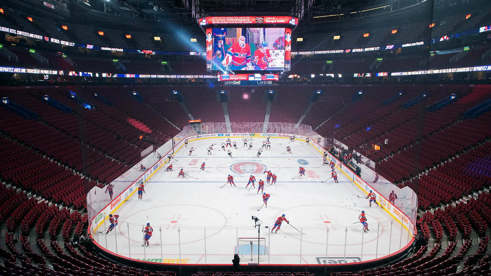 New Jersey Devils and Montreal Canadiens warm up before an NHL hockey game in Montreal, Tuesday, Feb., 8, 2022. (Graham Hughes/The Canadian Press via AP)