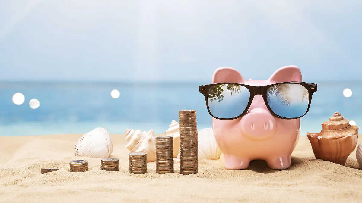 Pink Piggy Bank Near Growing Coin Stacks