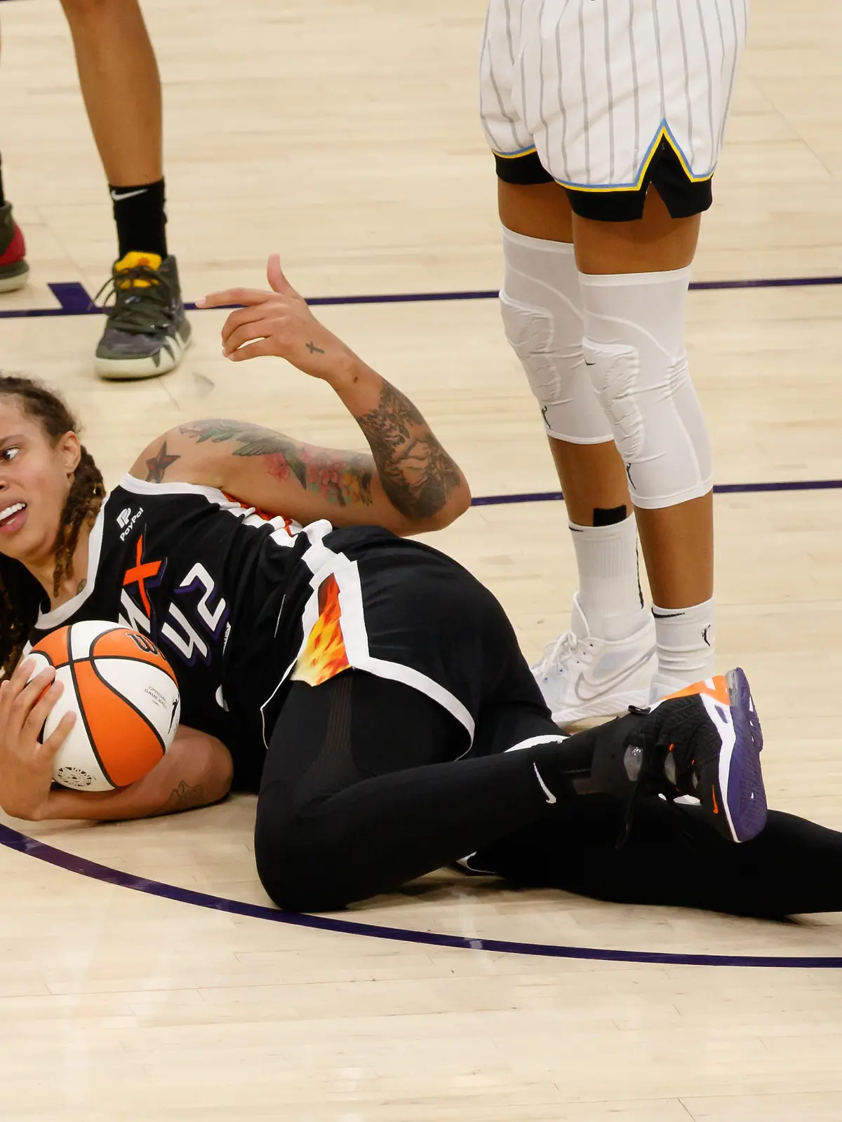 October 13, 2021, Phoenix, Arizona, United States: Phoenix, Arizona, October 13th 2 Brittney Griner (42 Phoenix Mercury) lies on the floor after being fouled during Game 2 of the Women's National Basketball Association Finals between Phoenix Mercury and Chicago Sky at Footprint Center Arena in Phoenix, Arizona. NO COMMERCIAL USAGE. (Credit Image: Â© Andrea Vilchez/Sport Press Photo via ZUMA Press