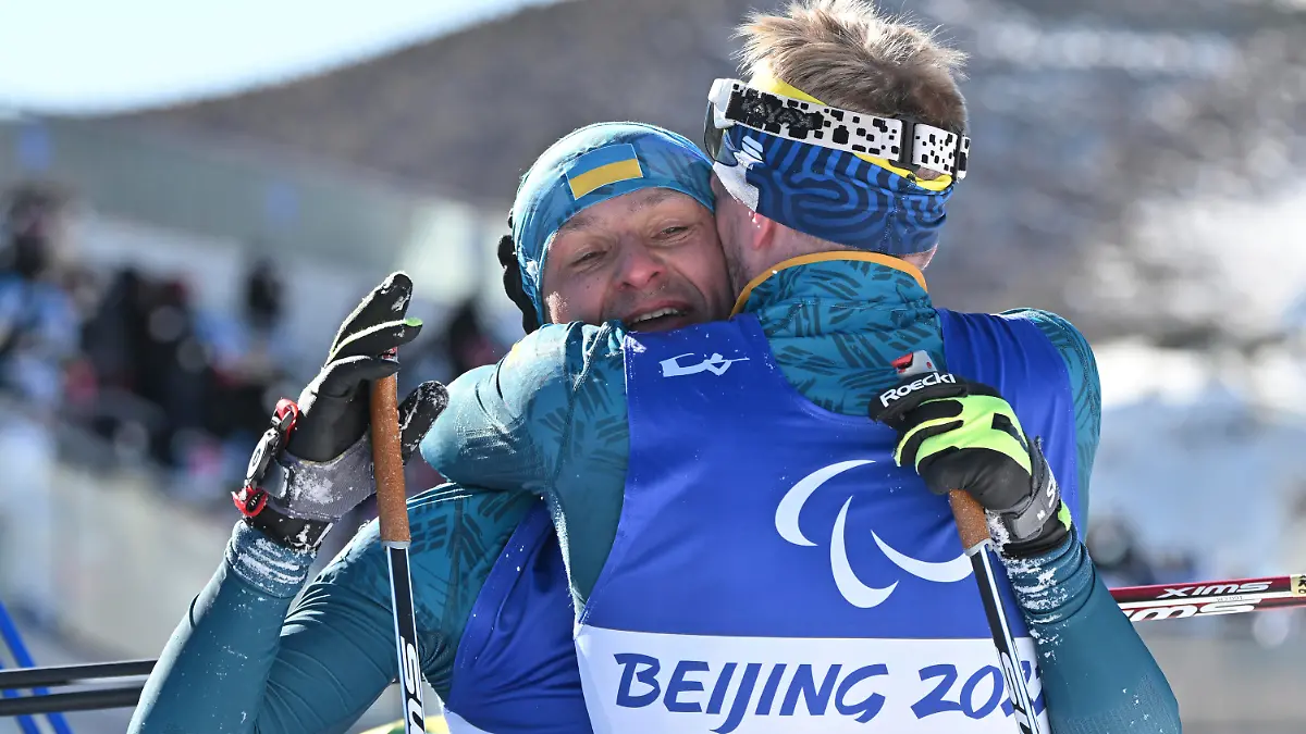 Ukraine's LUKIANENKO Vitalii celebrates after winning the Men's Sprint Vision Impaired - Para Biathlon at Zhangjiakou National Biathlon Centre in Zhangjiakou, Hebei, China on March 5, 2022. ( The Yomiuri Shimbun via AP Images )