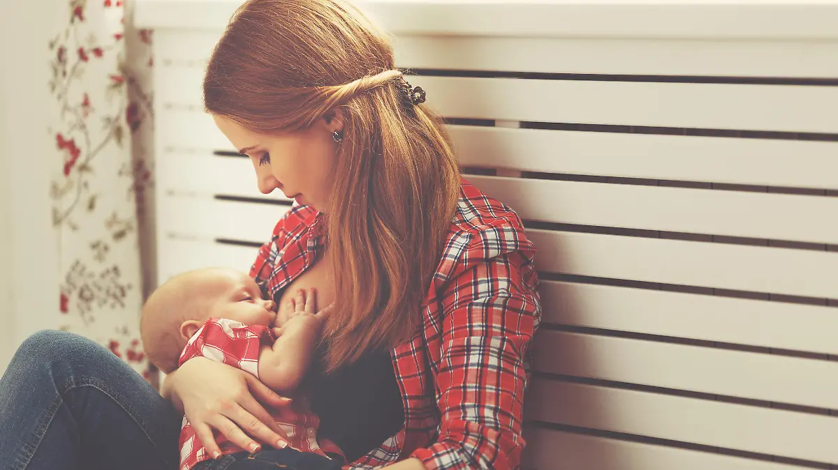 mother breast feeding her baby toddler