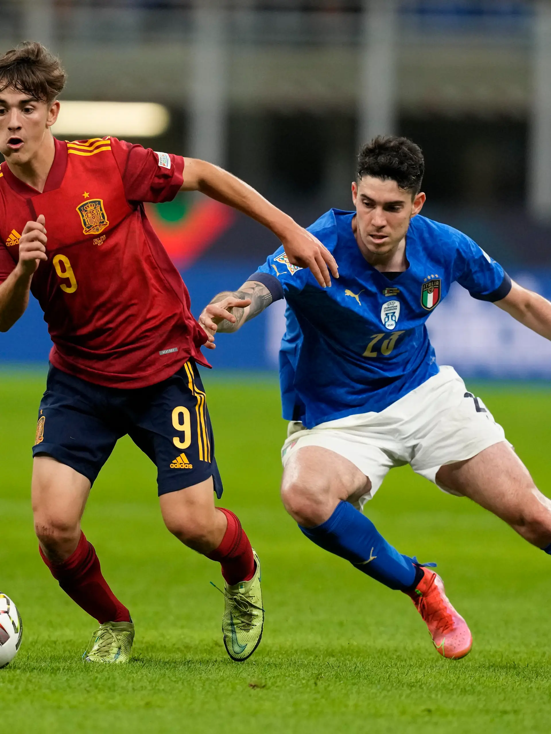 Spain's Gavi, left, and Italy's Alessandro Bastoni vie for the ball during the UEFA Nations League semifinal soccer match between Italy and Spain at the San Siro stadium, in Milan, Italy, Wednesday, Oct. 6, 2021. (AP Photo/Antonio Calanni)