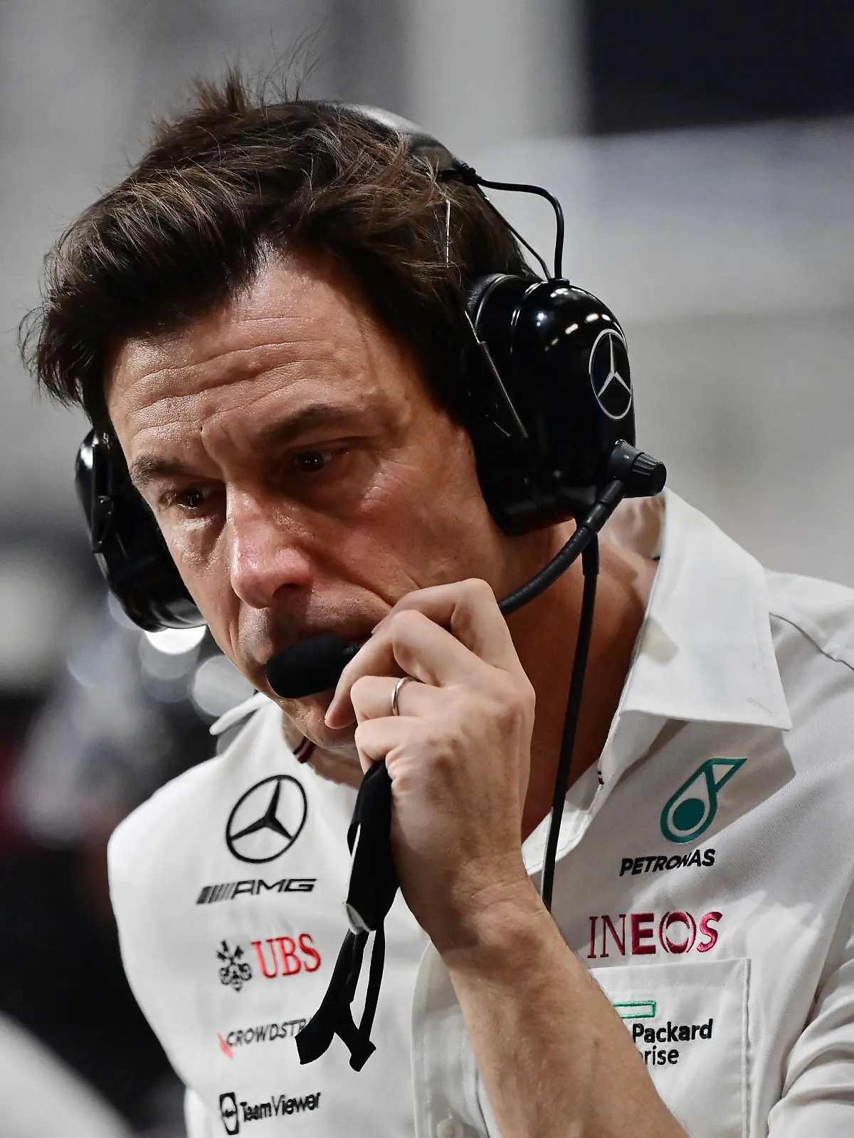 JEDDAH, SAUDI ARABIA - DECEMBER 05: Mercedes GP Executive Director Toto Wolff talks on his team radio in the Pitlane during the F1 Grand Prix of Saudi Arabia at Jeddah Corniche Circuit on December 05, 2021 in Jeddah, Saudi Arabia. (Photo by Andrej Isakovic - Pool/Getty Images)