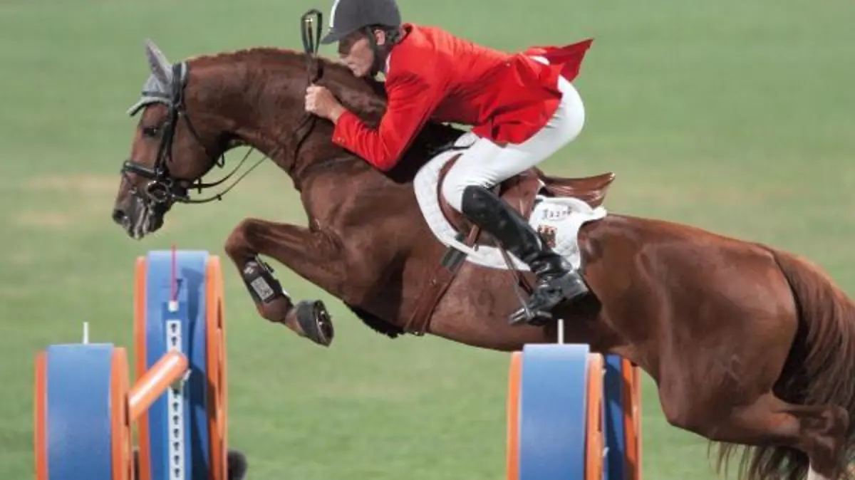 Ludger Beerbaum from Germany on his mount Goldfever clears an obstacle during the Mixed Individual Jumping Final of the Athens 2004 Olympic Games at Markopoulo Equestrian Center, Friday 27 August, 2004. epa/dpa Peter Kneffel