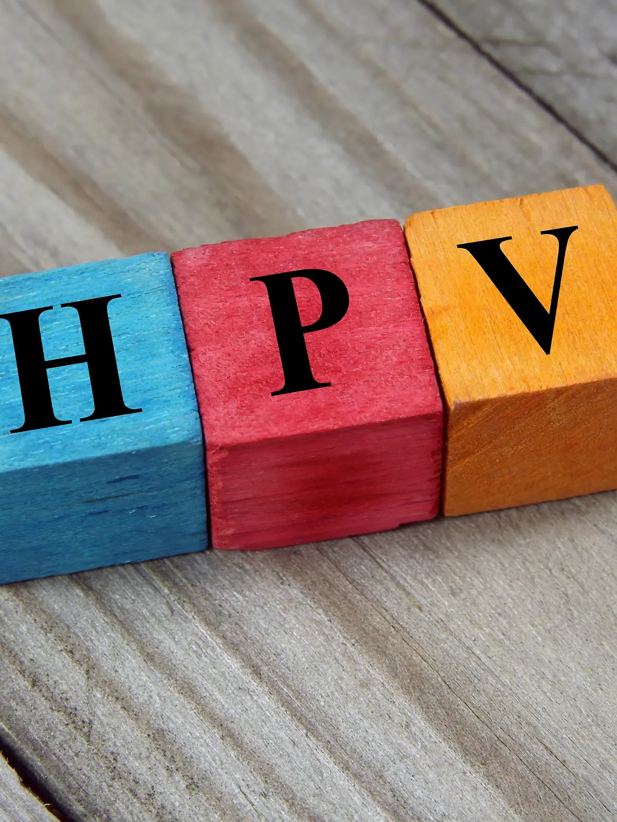 HPV (Human Papillomavirus) acronym on colorful wooden cubes