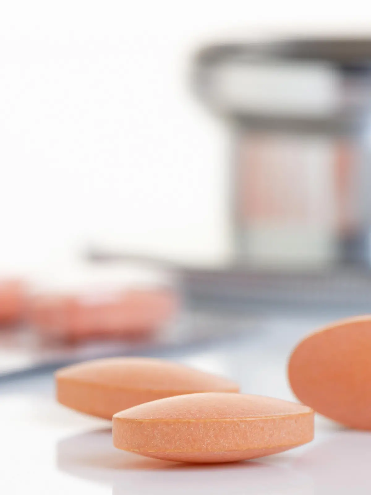 Close up of a Statin tablet - the controversial cholesterol lowering drug.  Shallow d o f