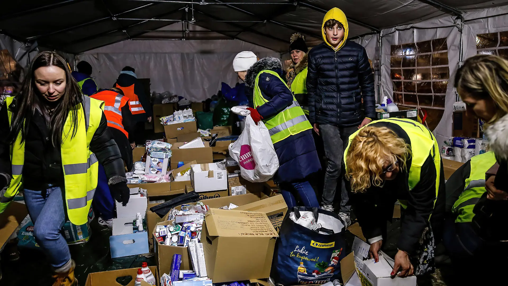 March 1, 2022, Przemysl, Poland: Volunteers sort donated medicine and sanitary products in the night..Thousands of refugees from Ukraine enter Poland as the Russian Federation army crossed Ukrainian borders, the conflict between Ukraine and Russian is expected to force up to 5 million Ukrainians to flee. Mixed origins escapees, mainly from Africa and central Asia say they were held for days at the Ukrainian border in extremely poor condition. Przemysl Poland - ZUMAs197 20220301_zaa_s197_280 Copyright: xDominikaxZarzyckax