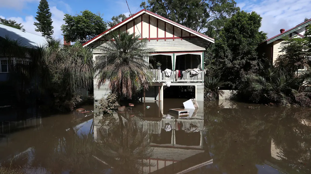 A view of flooded houses following heavy rains in Lismore, New South Wales, Australia March 2, 2022. AAP Image/Jason O'Brien via REUTERS ATTENTION EDITORS - THIS IMAGE WAS PROVIDED BY A THIRD PARTY. NO RESALES. NO ARCHIVE. AUSTRALIA OUT. NEW ZEALAND OUT.