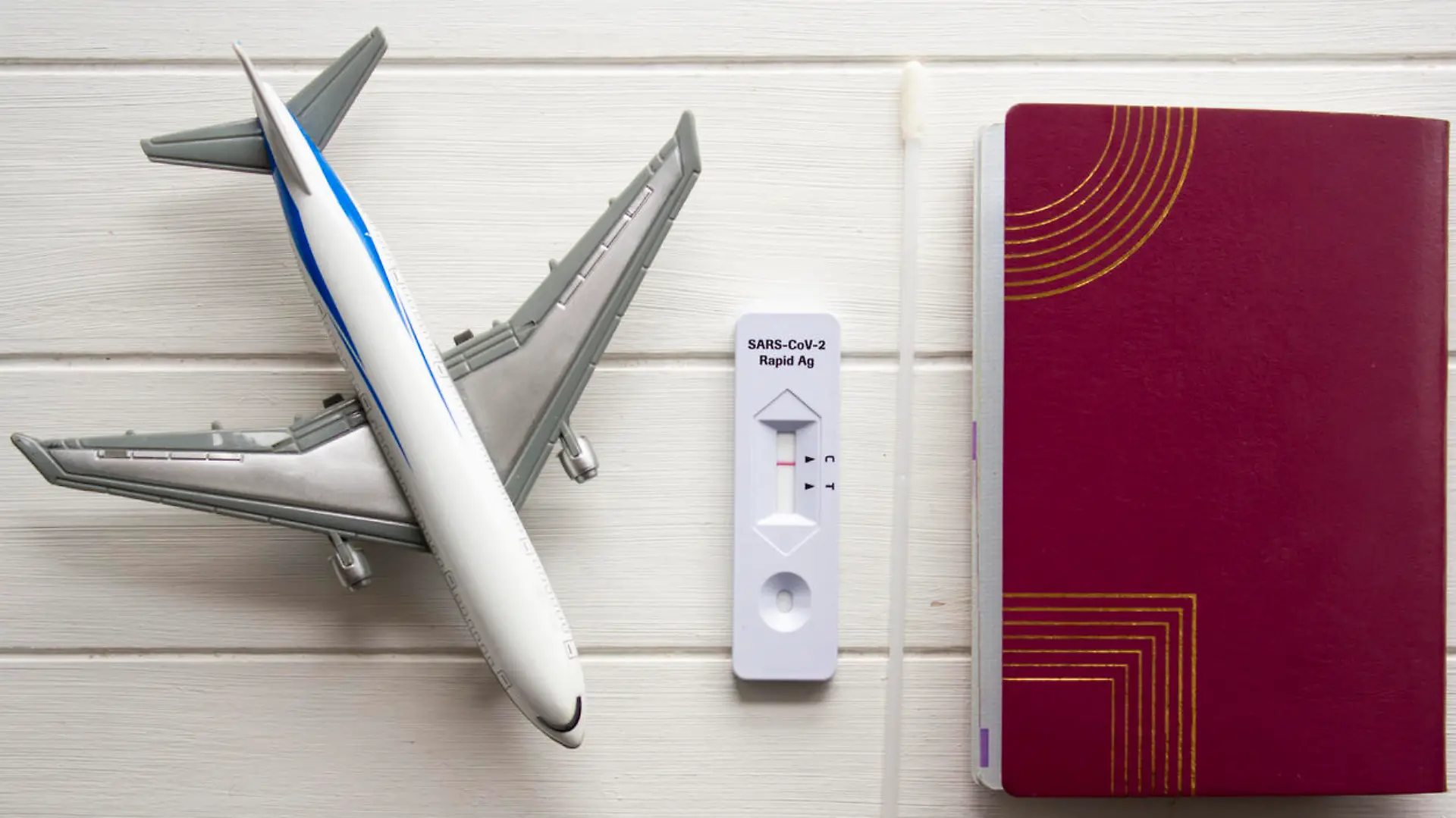 Passport, COVID-19 negative test and airplane. Travel during COVID-19 pandemic concept