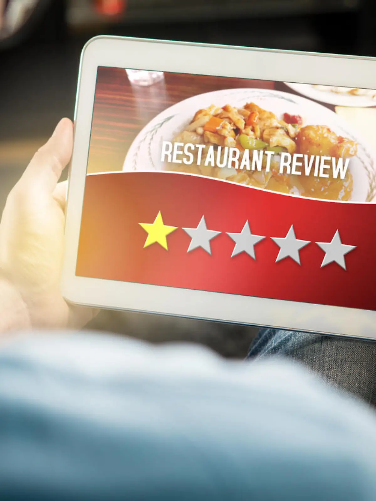 Bad restaurant review. Disappointed and dissatisfied customer giving terrible rating with tablet on an imaginary criticism site, application or website. Man giving one out of five stars at home.