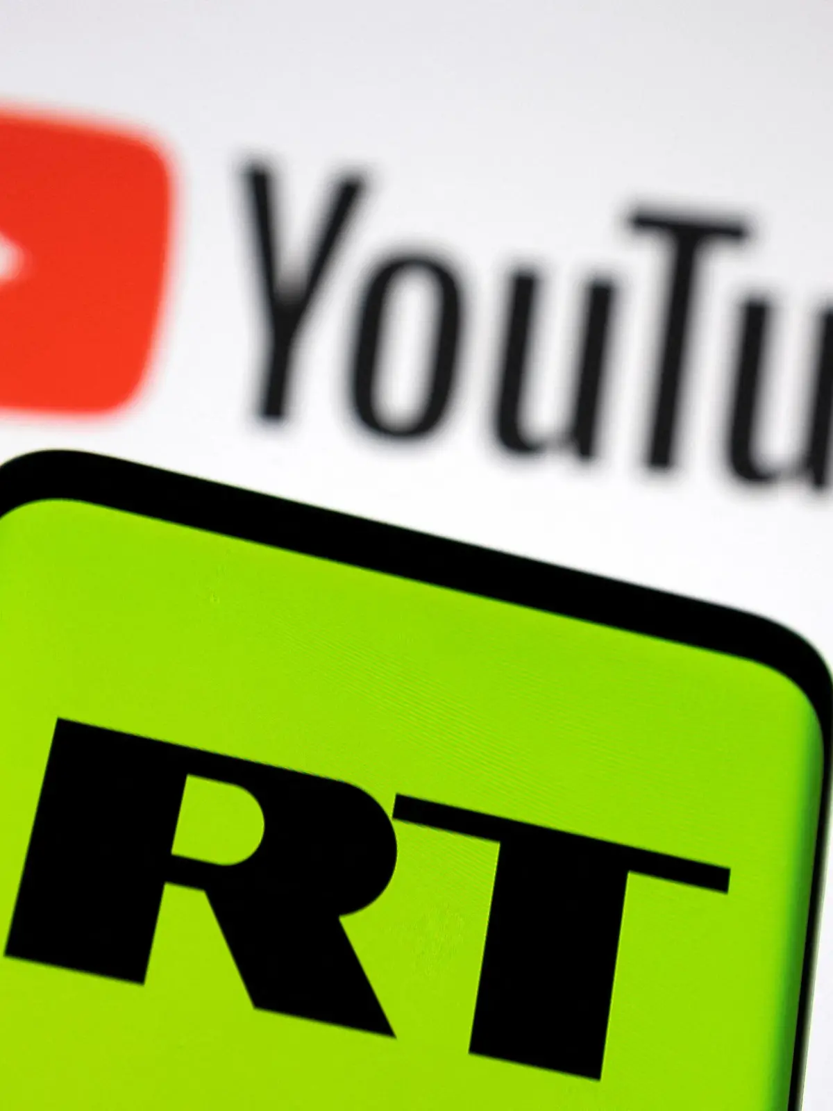 Russia Today (RT) logo is seen on a smartphone in front of displayed Youtube logo in this illustration picture taken February 26, 2022. REUTERS/Dado Ruvic/Illustration
