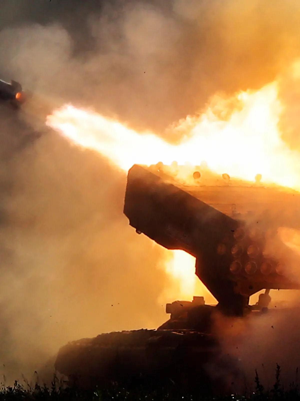 Russian heavy flamethrower system TOS-1 fires during the International Military Technical Forum Army-2018 in Alabino, outside Moscow, Tuesday, Aug. 21, 2018. Russia has displayed its latest weapons at a military show aimed at attracting more foreign customers. (AP Photo/Pavel Golovkin)