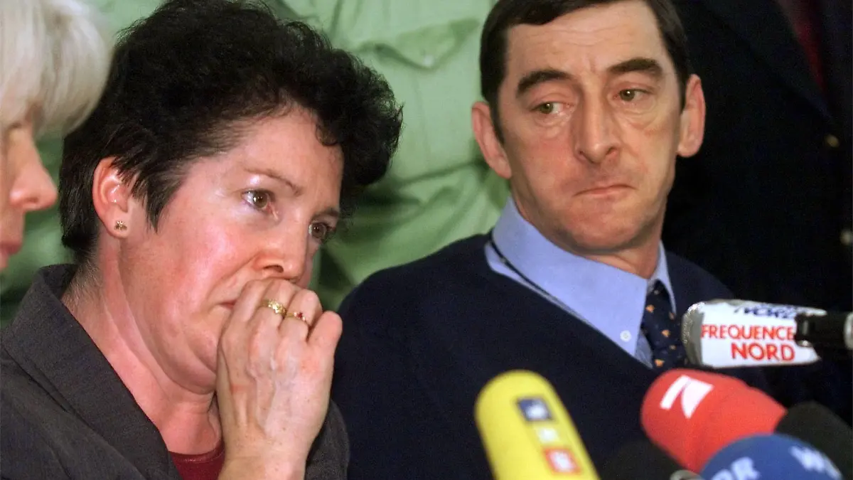 Lorette, left, wife of French police officer Daniel Nivel, right, during a press conference on Tuesday, November 9, 1999, in Essen, western Germany, after the conviction of four Germany soccer hooligans on charges in the near-fatal beating of Nivel during last year's soccer World Cup. The sidewalk attack took place on June 21, 1998 in Lens, France. The court handed down sentences ranging from 10 to 3 1/2 years in prison for the attack on Nivel. (AP Photo/Edgar R. Schoepal)