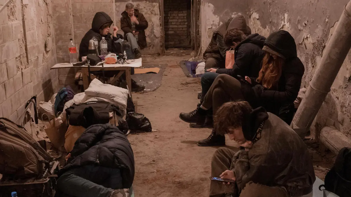 Residents take shelter in the basement of an apartment building, after Russia launched a massive military operation against Ukraine, in Kyiv, Ukraine early February 27, 2022. Picture taken February 27, 2022. Jedrzej Nowicki/Agencja Wyborcza.pl via REUTERS ATTENTION EDITORS - THIS IMAGE WAS PROVIDED BY A THIRD PARTY. POLAND OUT. NO COMMERCIAL OR EDITORIAL SALES IN POLAND.