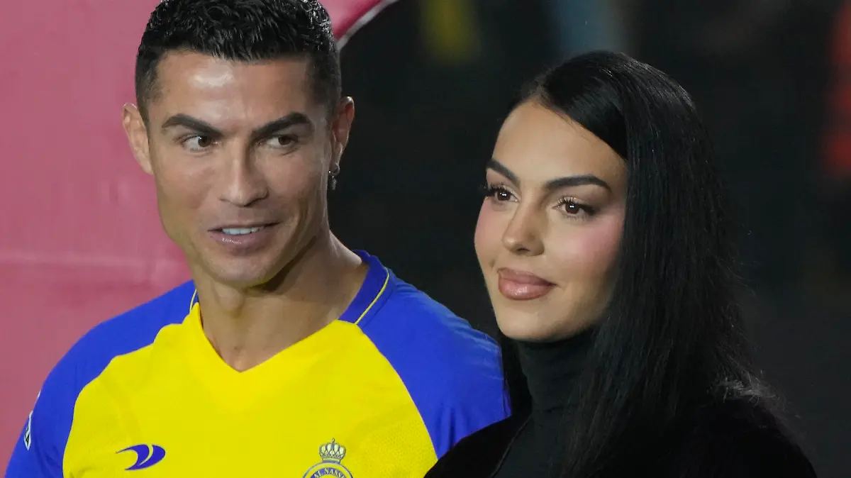 Cristiano Ronaldo looks at Georgina Rodriguez as they attend the official unveiling as a new member of Al Nassr soccer club in in Riyadh, Saudi Arabia, Tuesday, Jan. 3, 2023. Ronaldo, who has won five Ballon d'Ors awards for the best soccer player in the world and five Champions League titles, will play outside of Europe for the first time in his storied career. (AP Photo/Amr Nabil)