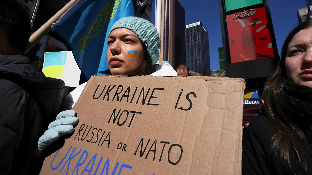 People take part in a "Stand with Ukraine" rally, against Russia's massive military operation in Ukraine, in Times Square in New York City, U.S., February 26, 2022. REUTERS/David 'Dee' Delgado