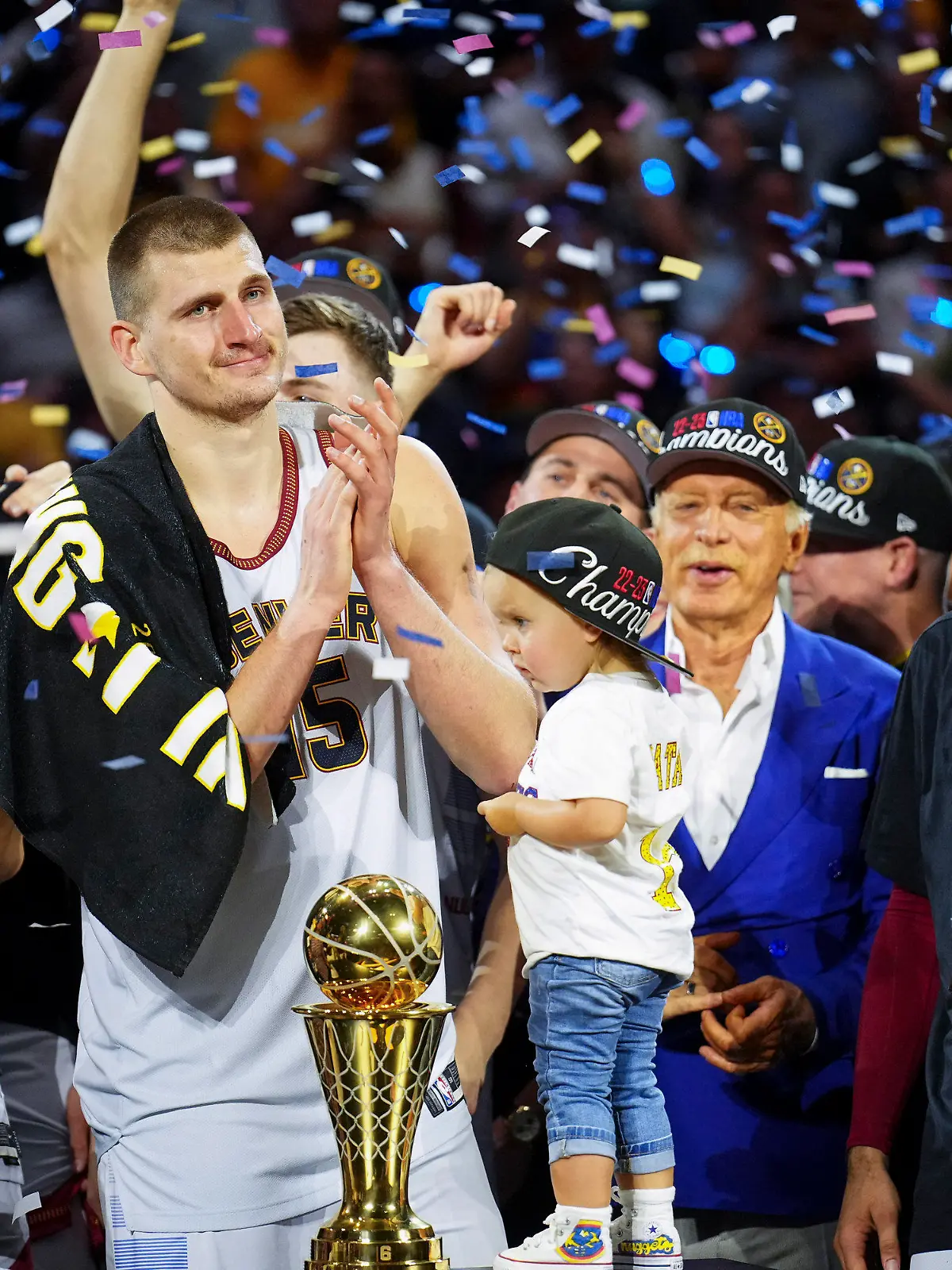 Denver Nuggets center Nikola Jokic, center left, celebrates with teammates after the team won the NBA Championship with a victory over the Miami Heat in Game 5 of basketball's NBA Finals, Monday, June 12, 2023, in Denver. (AP Photo/Jack Dempsey)