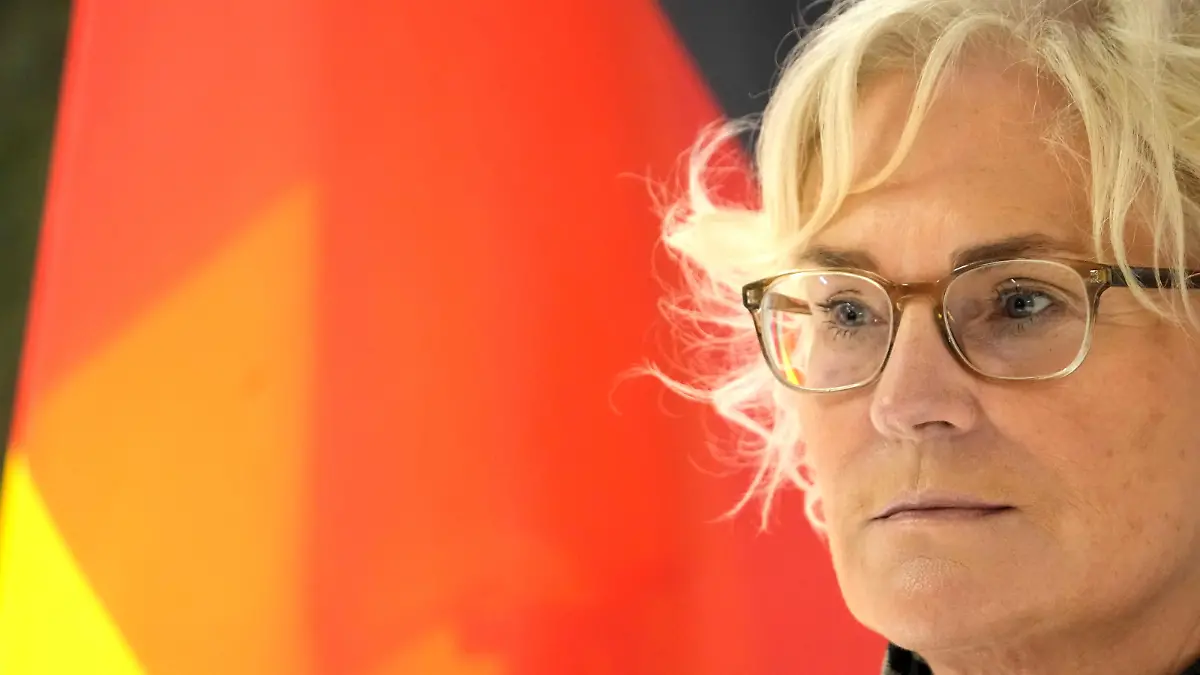 German Defence Minister Christine Lambrecht listens during news conference as she visits German troops in Rukla military base, Lithuania February 22, 2022. REUTERS/Ints Kalnins