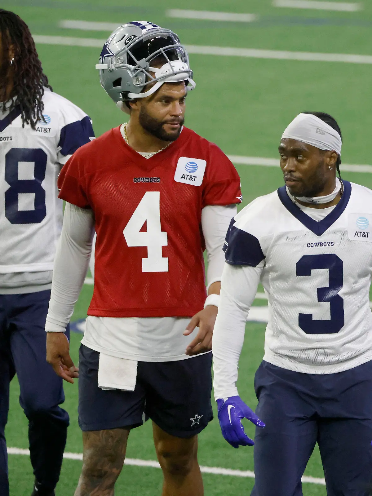 Dallas Cowboys wide receiver CeeDee Lamb (88), quarterback Dak Prescott (4) and wide receiver Brandin Cooks (3) walk off the field during NFL football practice at the team's training facility in Frisco, Texas, Thursday, May 25, 2023. (AP Photo/Michael Ainsworth)