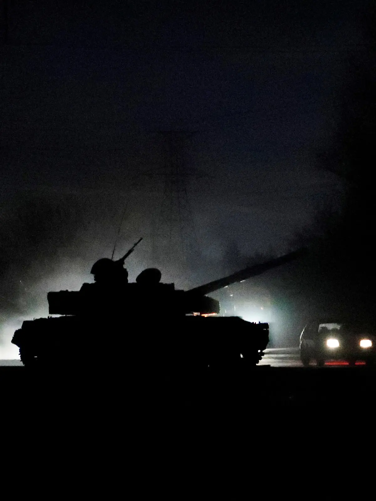 A tank drives along a street after Russian President Vladimir Putin ordered the deployment of Russian troops to two breakaway regions in eastern Ukraine following the recognition of their independence, in the separatist-controlled city of Donetsk, Ukraine February 22, 2022. REUTERS/Alexander Ermochenko     TPX IMAGES OF THE DAY