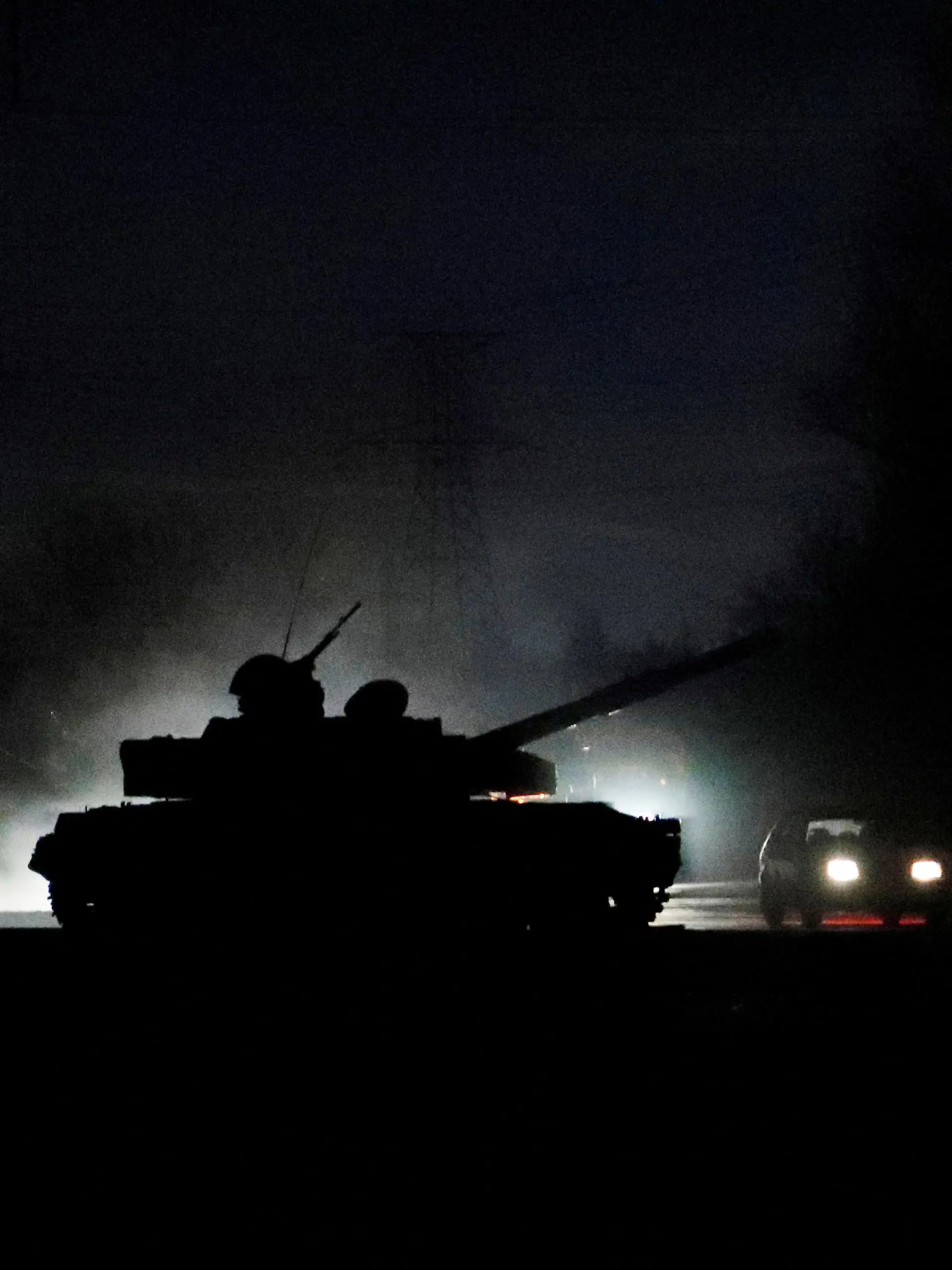 A tank drives along a street after Russian President Vladimir Putin ordered the deployment of Russian troops to two breakaway regions in eastern Ukraine following the recognition of their independence, in the separatist-controlled city of Donetsk, Ukraine February 22, 2022. REUTERS/Alexander Ermochenko     TPX IMAGES OF THE DAY