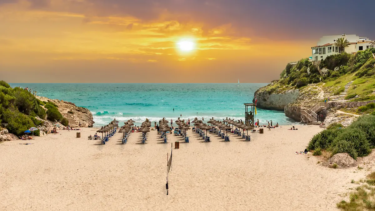Beautiful vibrant sunrise on the paradise beach on Cala Domingos playa de Mallorca in the summer holiday, Spain