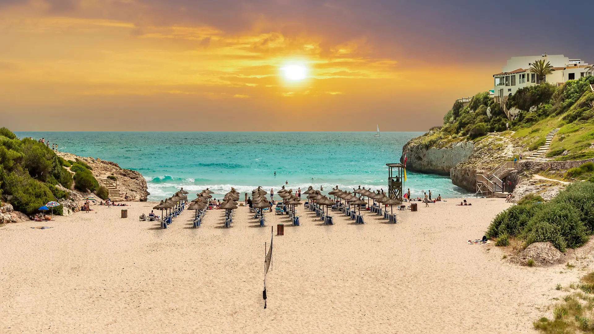 Beautiful vibrant sunrise on the paradise beach on Cala Domingos playa de Mallorca in the summer holiday, Spain