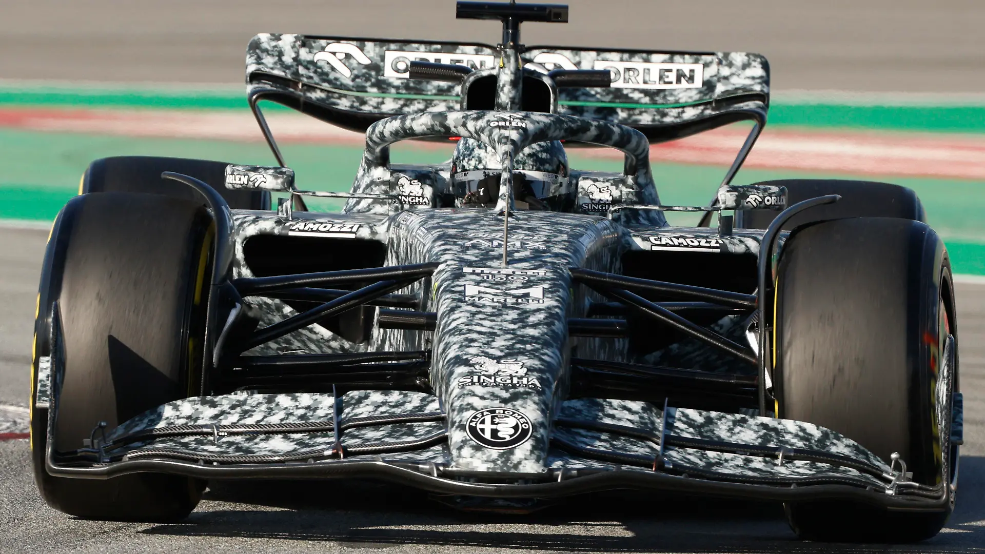Alfa Romeo reserve driver Robert Kubica steers the car during a Formula One pre-season testing session at the Catalunya racetrack in Montmelo, just outside of Barcelona, Spain, Wednesday, Feb. 23, 2022. (AP Photo/Joan Monfort)