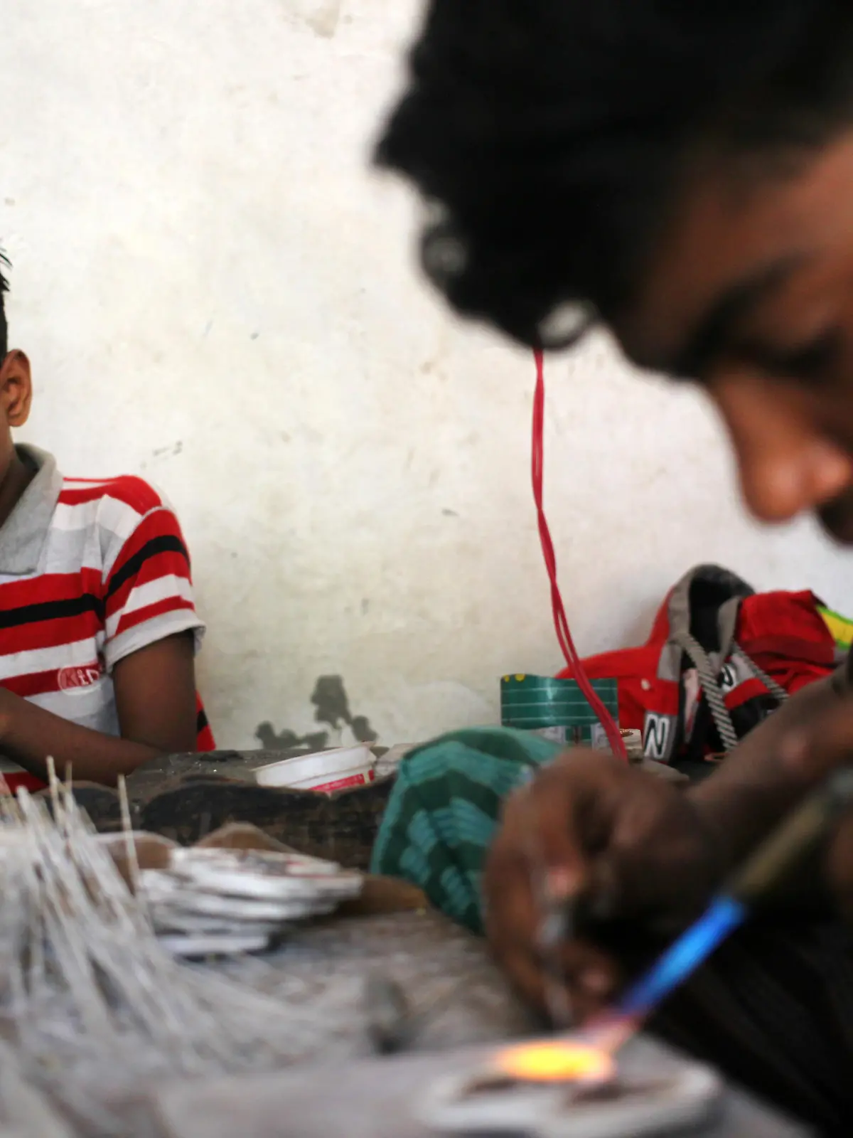 Workers make copper jewelry at Bhakurta Village in Savar area near Dhaka, Bangladesh on Thursday 24 December 2020. (Photo by Syed Mahamudur Rahman/NurPhoto)